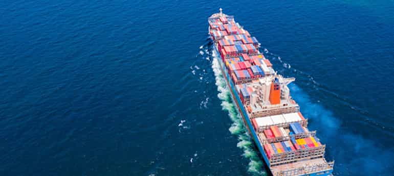 aerial image of a freight vessel in open water